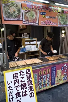 Takoyaki (octopus balls) stand in Dotonbori entertainment district of Namba