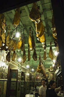 Seville Prints: Tapas bar and restaurant with hams hanging from the ceiling