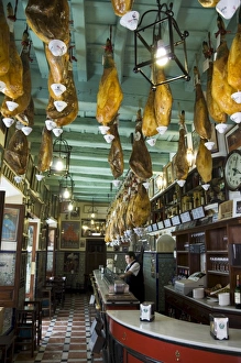 Tapas bar and restaurant with hams hanging from the ceiling