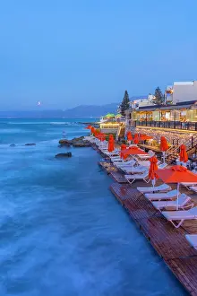 Chairs Prints: Taverna by the sea in Limenas Chersonisou during sunset in Crete, Greece