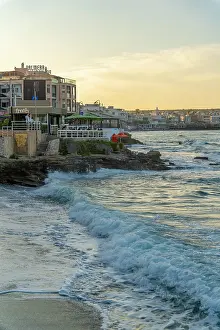 Chairs Prints: Taverna view by the sea at sunset in Limenas Chersonisou