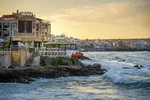 Terrace Prints: Taverna view at sunset with sea waves in Limenas Chersonisou, Crete, Greece