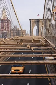 Taxi crossing Brooklyn Bridge, New York City, New York, United States of America