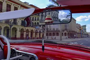 Mirror Prints: Taxi driver in straw hat seen in rear-view mirror of vintage car, Havana, Cuba