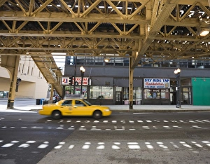Cabs Prints: Taxi on a road under The El, elevated train system, The Loop, Chicago, Illinois