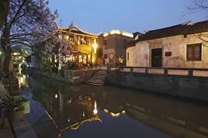 Images Dated 12th April 2009: Teahouse at dusk along canal, Suzhou, Jiangsu, China, Asia