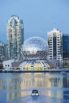 Telus s cience World and a boat on Fals e Creek, Vancouver, Britis h Columbia