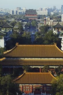 Temple buildings in Jingshan Park looking down to the Drum tower in the distance