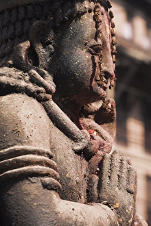 Bagmati Prints: Temple statue adorned with red pigment, Patan, Bagmati, Nepal, Asia