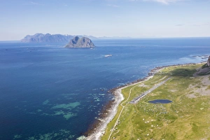 Nordland County Gallery: Tents in the green meadows surrounded by blue lake and sea, Vaeroy Island, Nordland county