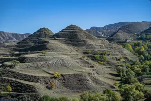 Terrace Prints: Terrace fields highlight agriculture in Dagestan's landscape with clear skies and structured hills