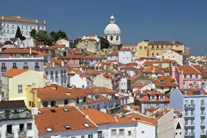 Terracotta roofs and the ancient dome seen from Miradouro Alfama one of the many
