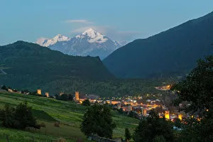Tetnuldi mountain, 4858 m, rising above Mestia at twilight, Svaneti mountains, Georgia, Central Asia, Asia