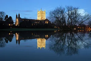 Romanesque Prints: Tewkesbury Abbey reflected in water at dusk, Tewkesbury, Gloucestershire, England