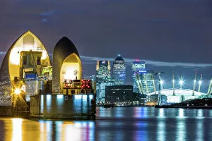 London Gallery: Thames Barrier, Millennium Dome (O2 Arena) and Canary Wharf at night, London, England