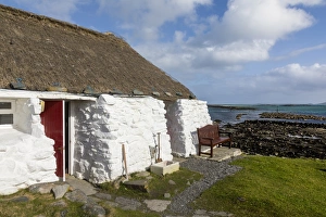 Cottage Prints: Thatched cottage and hostel, Isle of Berneray, North Uist, Outer Hebrides, Scotland