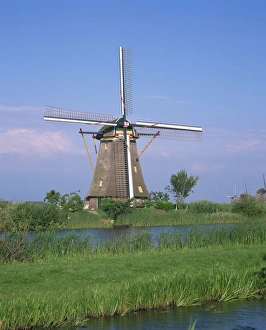 Kinderdijk Prints: Thatched windmills on the canal at Kinderdijk