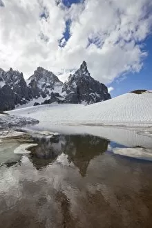 Images Dated 3rd June 2010: Thawing snow leaving some puddles at the foot of the Pale di San Martino by San Martino di