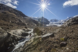 Gushing Prints: Tibetan bridge with Peaks of Cadini and Pejo in background, Cedec Valley, Valfurva