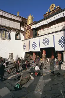 Signaling Prints: Tibetan Buddhist pilgrims prostrating in front of the Jokhang temple, Lhasa
