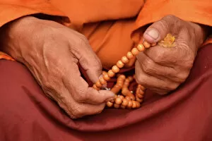 Close Up View Gallery: Tibetan monk holding prayer beads, Nepal, Asia