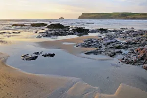 Images Dated 8th April 2010: Tide retreating at sunset leaving tide pools among rocks, with Pentire Head in the background