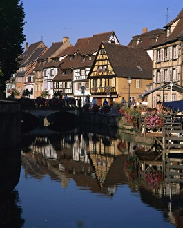 Haut Rhin Prints: Timbered houses reflected in water in the evening, Petite Venise, Colmar