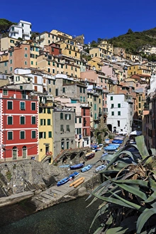 Tiny harbour and medieval houses in steep ravine, Riomaggiore, Cinque Terre, UNESCO