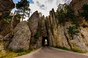 Tunnel Prints: Tiny road passing under a small mountain in the Black Hills of Keystone, South Dakota