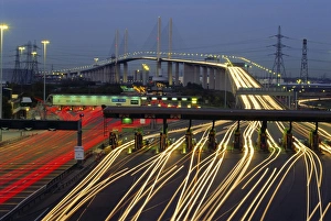 Time Exposure Prints: Tollgates on Queen Elizabeth Bridge at night, M25, Dartford, Kent, England, UK, Europe