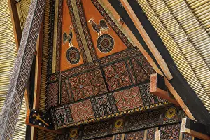 Toraja Prints: Tongkonan (rice barn) (house) with cockerel and sun motifs at a village North of Rantepao