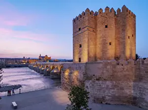 Torre de la Calahorra (Calahorra Tower) on the Roman Bridge at dusk