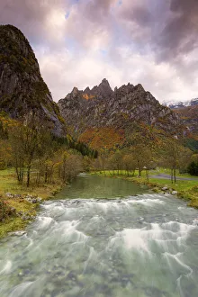 Autumnal Prints: Torrent surmounted by mountains at sunrise, Valmasino, Valtellina, Lombardy, Italy