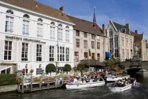 Images Dated 14th September 2010: Tour boat on the canal in Bruges, West Flanders, Belgium, Europe