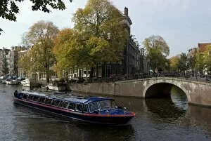 Tourist boat on one of the canals, Amsterdam, Netherlands, Europe