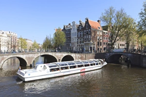Keizersgracht Prints: Tourist boat crossing Keizersgracht Canal, Amsterdam, Netherlands, Europe