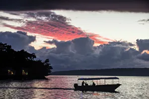 Passenger Prints: Tourist boat driving back home at sunset in Port Vila, Efate, Vanuatu, Pacific
