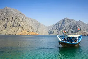 Dhow Prints: Tourist boat in form of a dhow sailing in the Khor ash-sham fjord