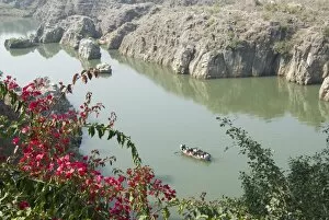 Tourist boat going into the Marble Rocks Gorge, on the Narmada River, Bhedaghat