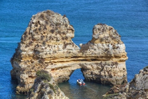 Sea Arch Prints: Tourist boat manoeuvering through the Grotos of Ponta da Piedade, Algarve, Portugal