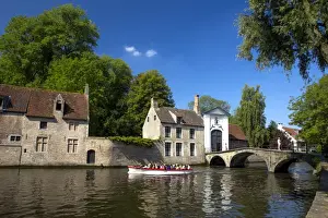 Bruges Prints: Tourist boat, at the Minnewater Lake and Begijnhof Bridge with entrance to Beguinage