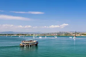 Typically Italian Gallery: Tourist boat trip in Ortigia (Ortygia) harbour, Syracuse (Siracusa), Sicily, Italy, Mediterranean