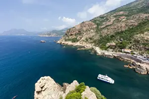 Tour Boat Prints: Tourist boat in the turquoise sea framed by limestone cliffs, Porto, Southern Corsica