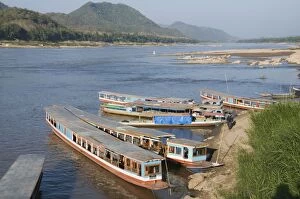 Tourist boats at the Pak Ou caves, Mekong River near Luang Prabang, Laos