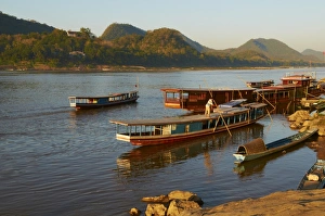 Tourist boats at sunset on the Mekong River, Luang Prabang, Laos, Indochina