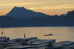 Tourist boats at sunset on the Mekong River, Luang Prabang, Laos, Indochina