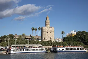 And Xad Prints: Tourist boats in front of the Torre del Oro (Gold Tower) in Seville, Andalucia, Spain