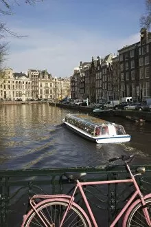 Tourist canal boat on the Herengracht canal, Amsterdam, Netherlands, Europe