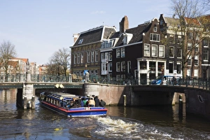 Rider Prints: Tourist canal boat on the Leidsegracht canal, Amsterdam, Netherlands, Europe