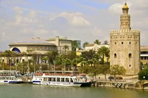 Images Dated 13th April 2010: Tourist cruise boat on Guadalquivir river, in front of Theatro de la Maestranza